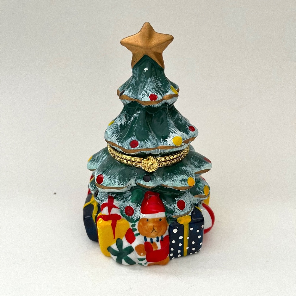 Christmas tree box with toys underneath and candle inside or trinket box